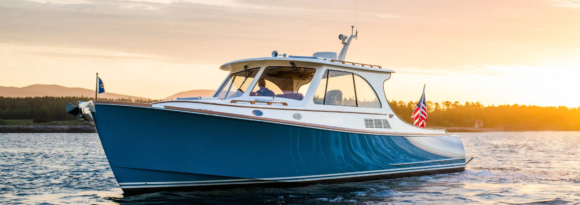 Hinckley yacht cruising on the water at sunset during the Edgartown experience