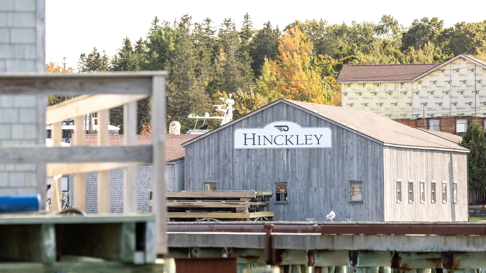 Hinckley waterfront building and dock pilings in Southwest Harbor