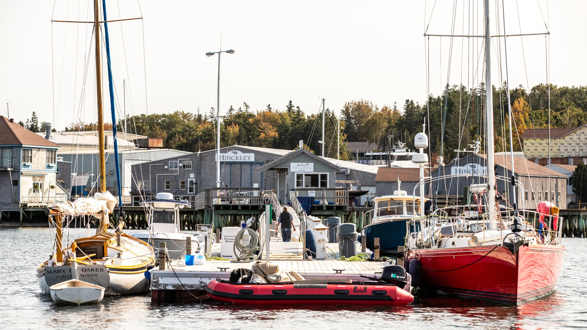 Sailboats docked side by side at the Southwest Harbor service yard
