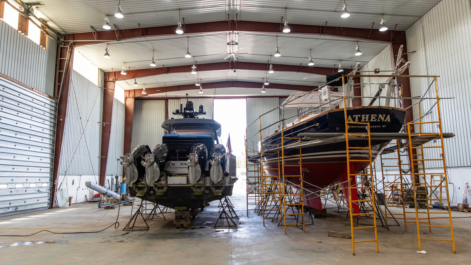 Sail and power yachts stored inside the Southwest Harbor service bay