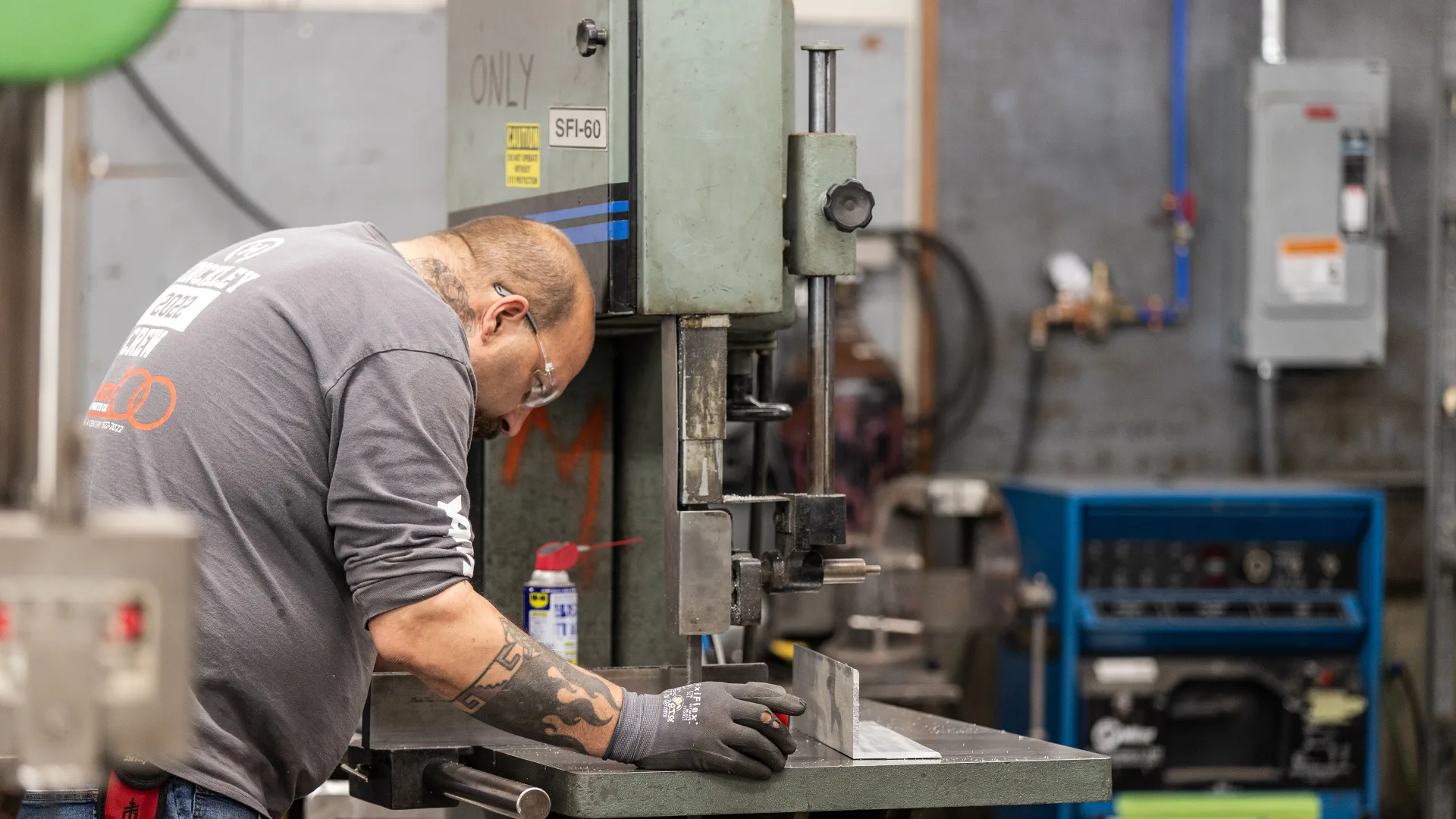 Technician using tools at a machine shop station in Southwest Harbor