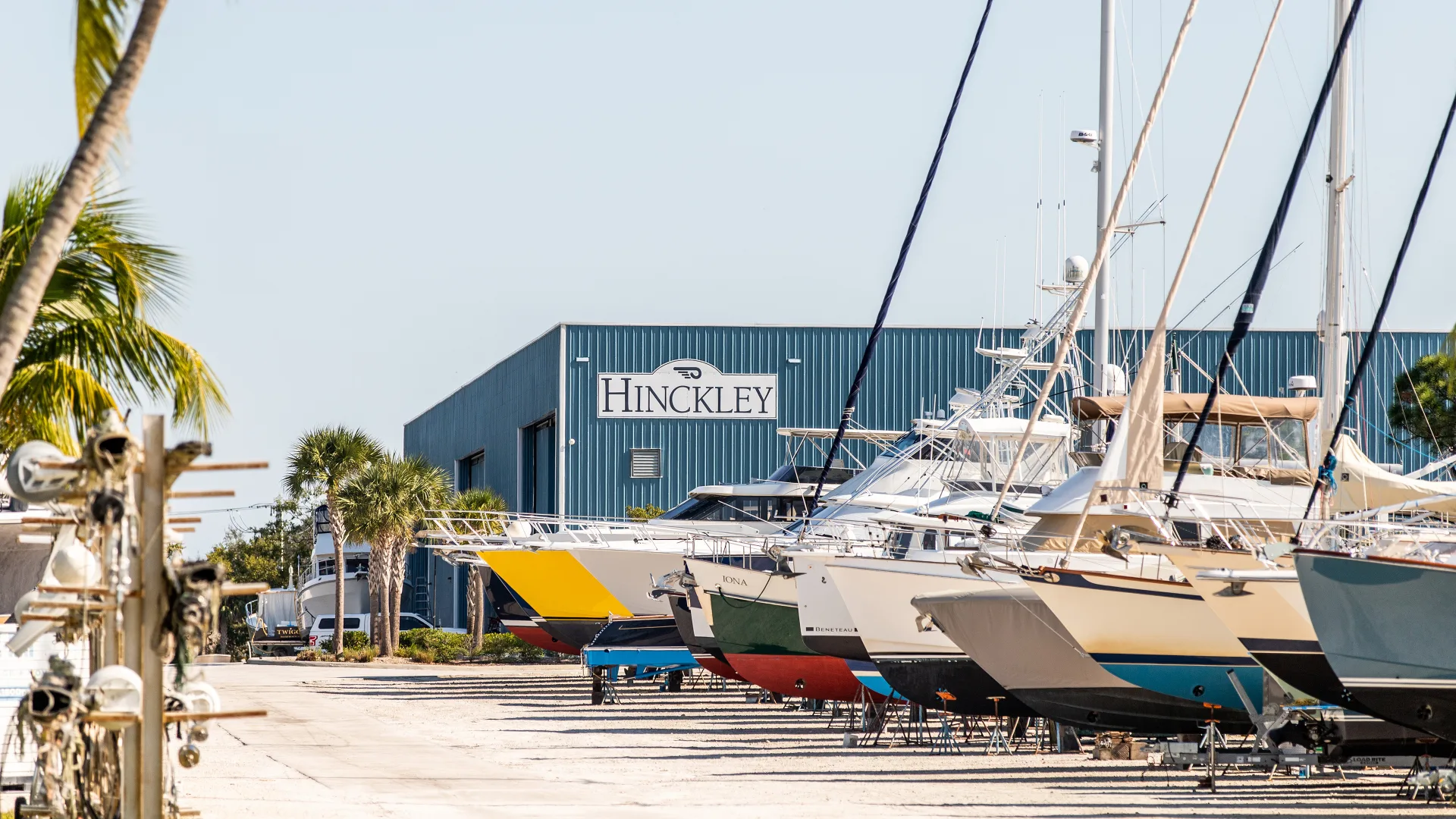 Boats on stands lined up outside the Stuart service building