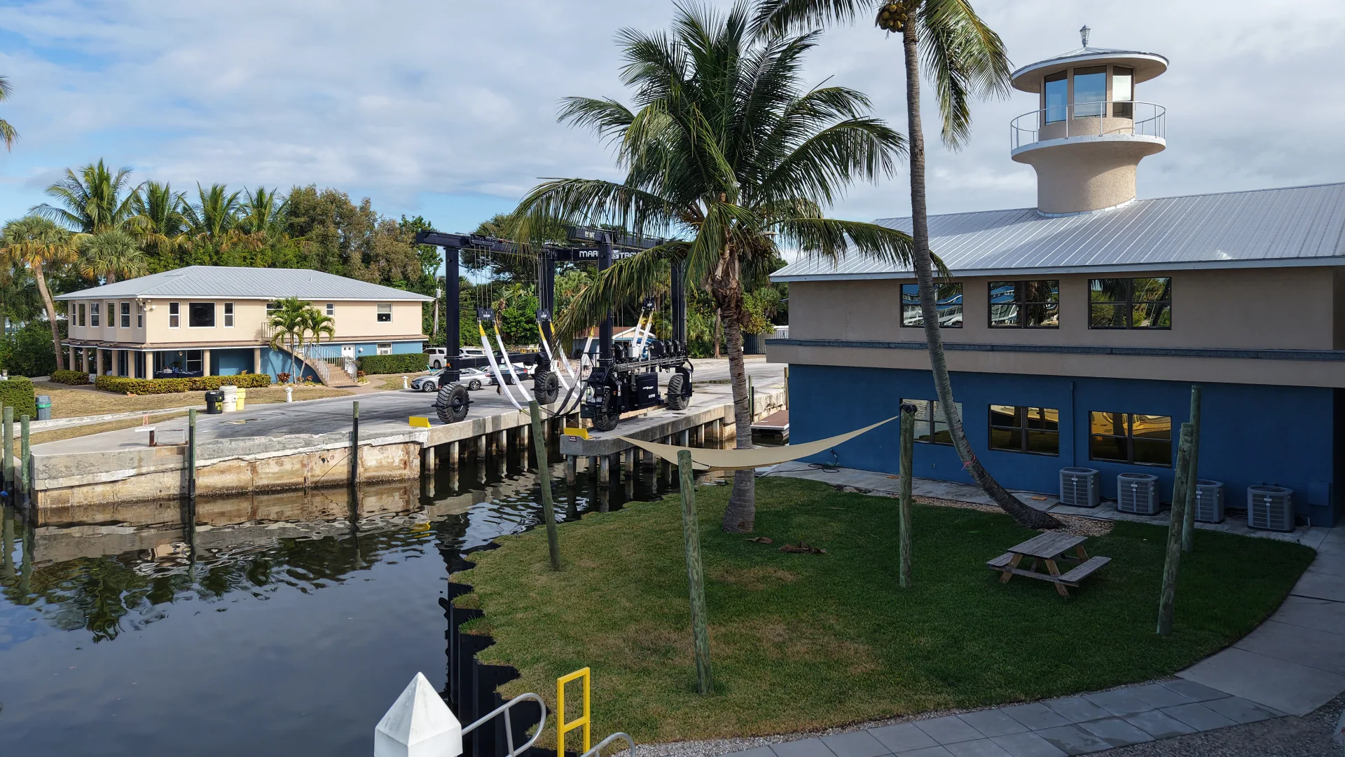 Stuart waterfront service building with docks and moored boats