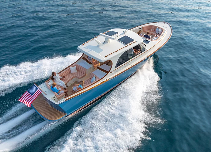Hinckley Picnic Boat 39 bow seating with couple cruising on open water