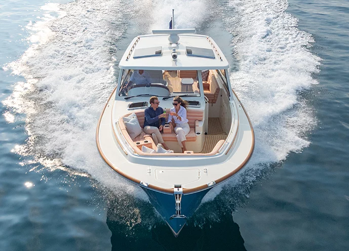 Hinckley Picnic Boat 39 bow seating with couple cruising on open water