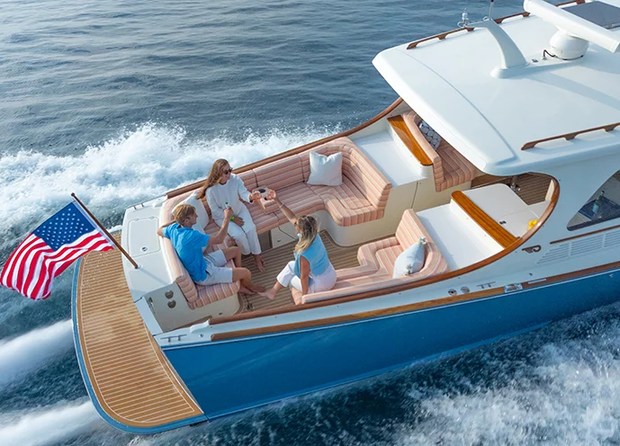 Hinckley Picnic Boat 39 cockpit seating area with passengers cruising offshore