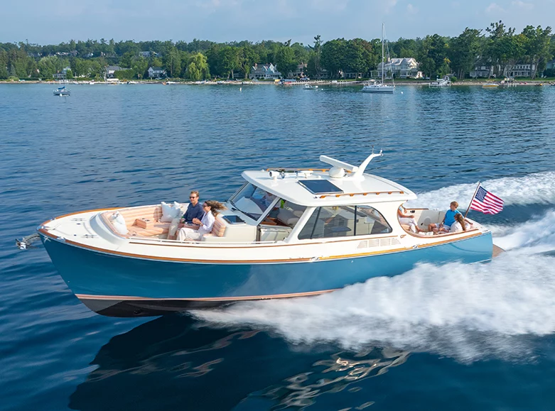 Hinckley Picnic Boat 39 cruising at speed with passengers on open water