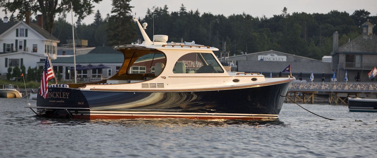 Hinckley Picnic Boat docked in Maine harbor showcasing classic Downeast design