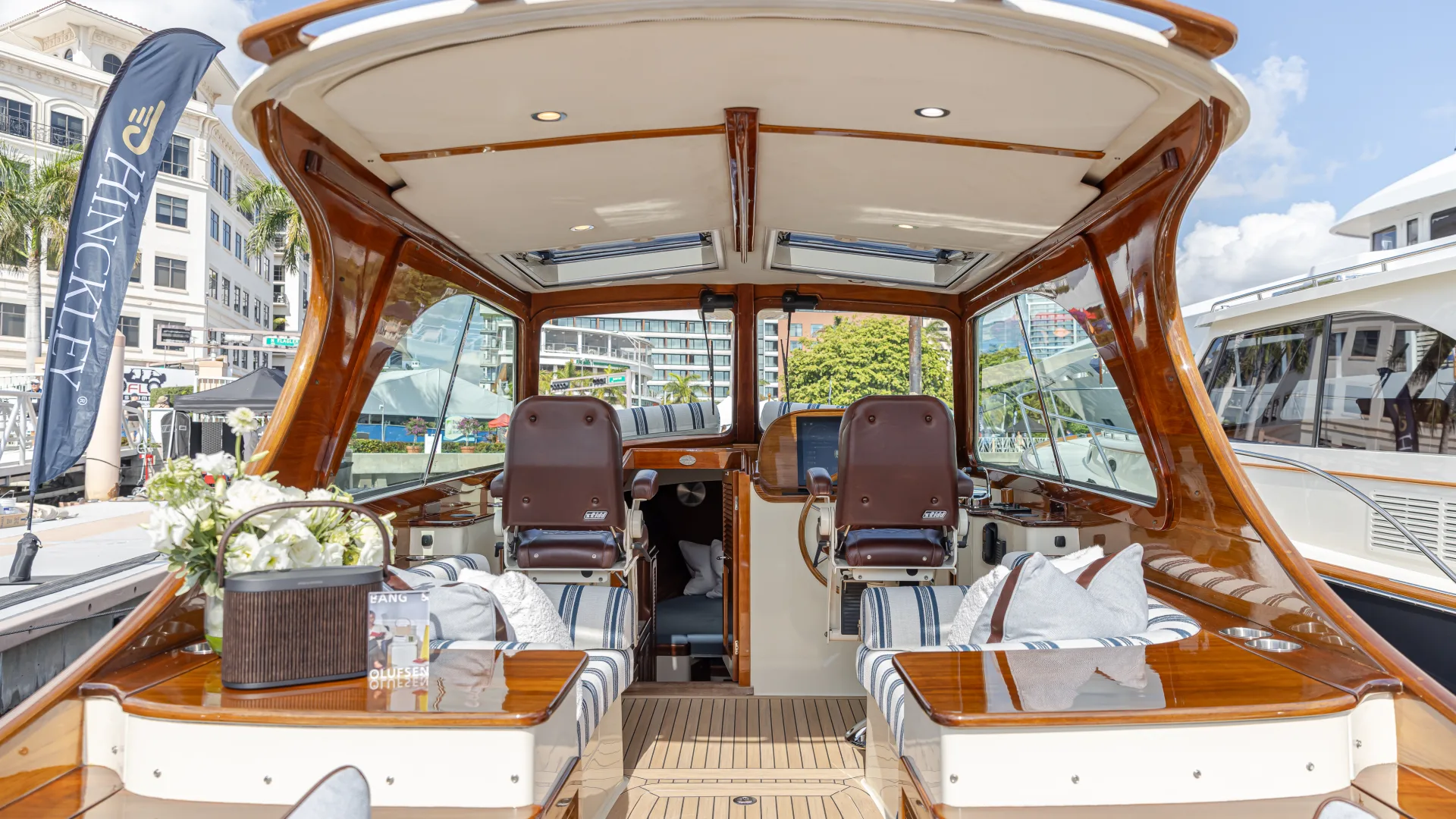 Hinckley Picnic Boat interior helm seating with teak finishes and luxury cockpit layout