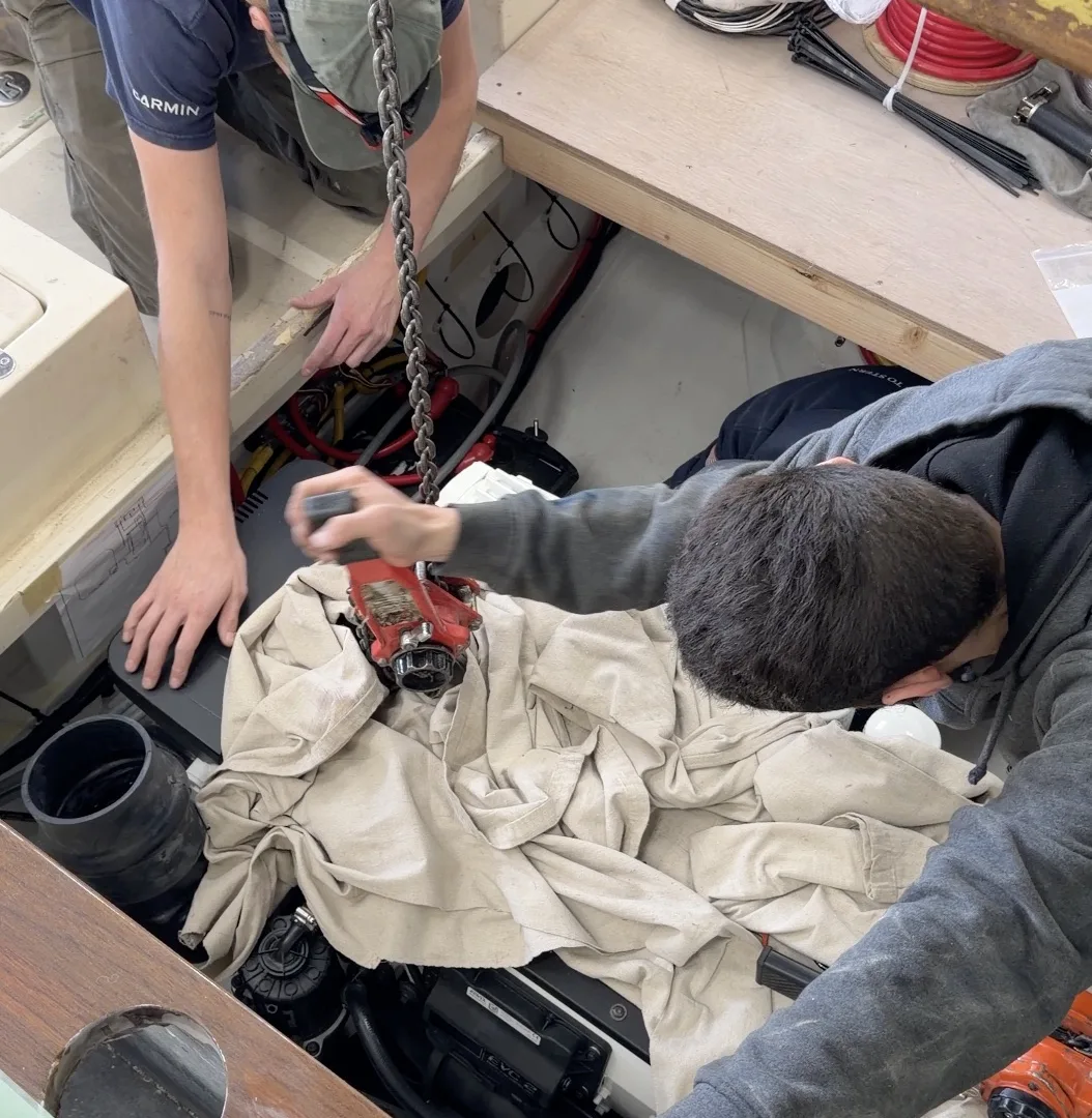 Hinckley yacht service team working on engine system during maintenance