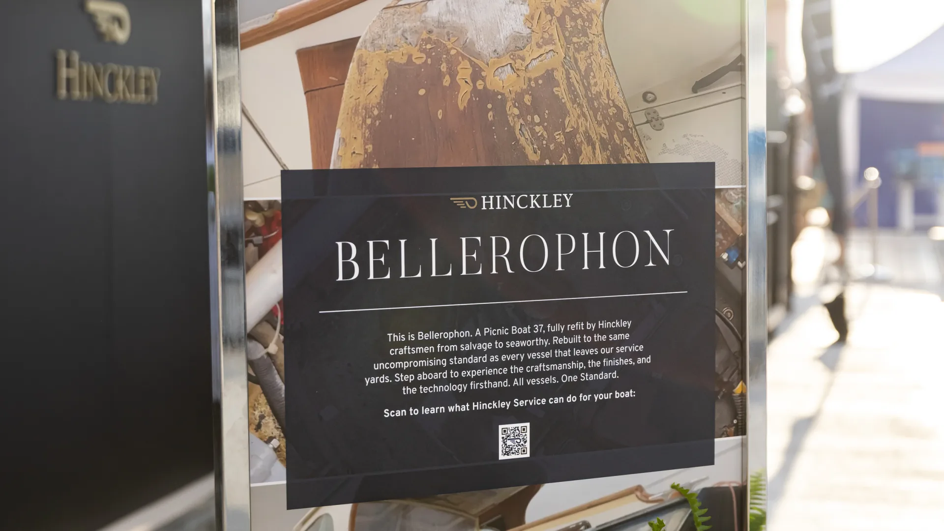 Hinckley Bellerophon display sign at boat show with yacht in background