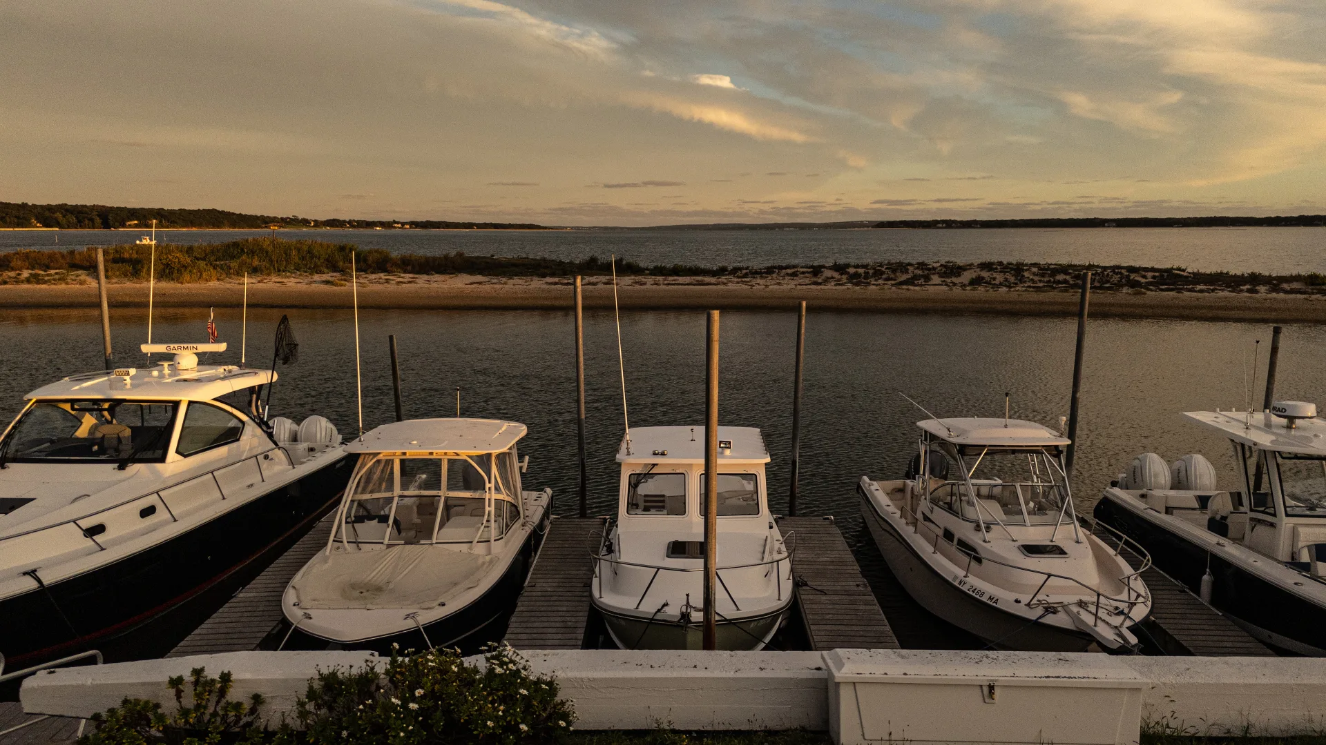 Powerboats and sailboats docked at Port of Egypt marina in Southold
