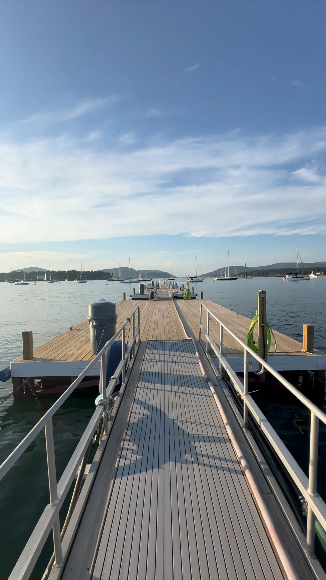 Dock ramp leading down to boats moored in Northeast Harbor