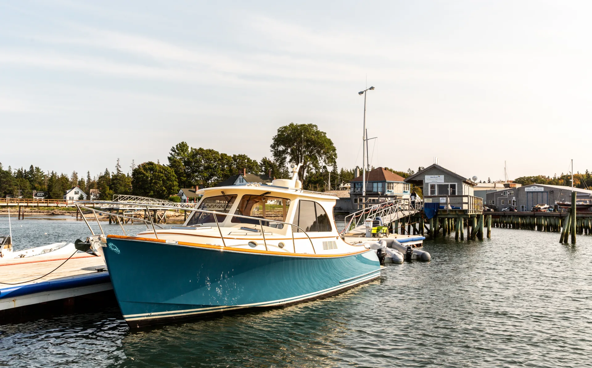 Hinckley picnic boat tied alongside a dock in Northeast Harbor