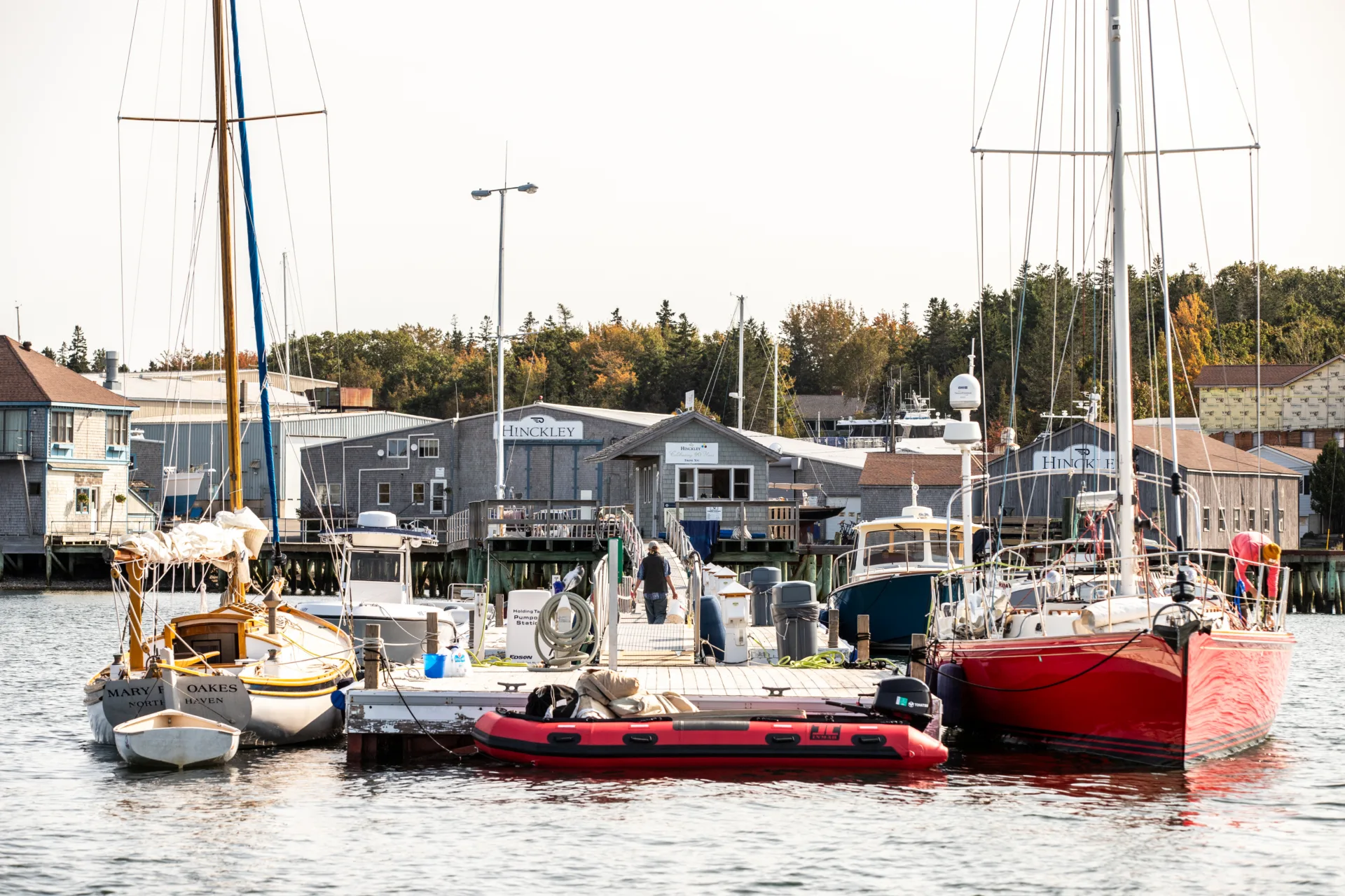 Sailboats docked beside the Northeast Harbor service yard