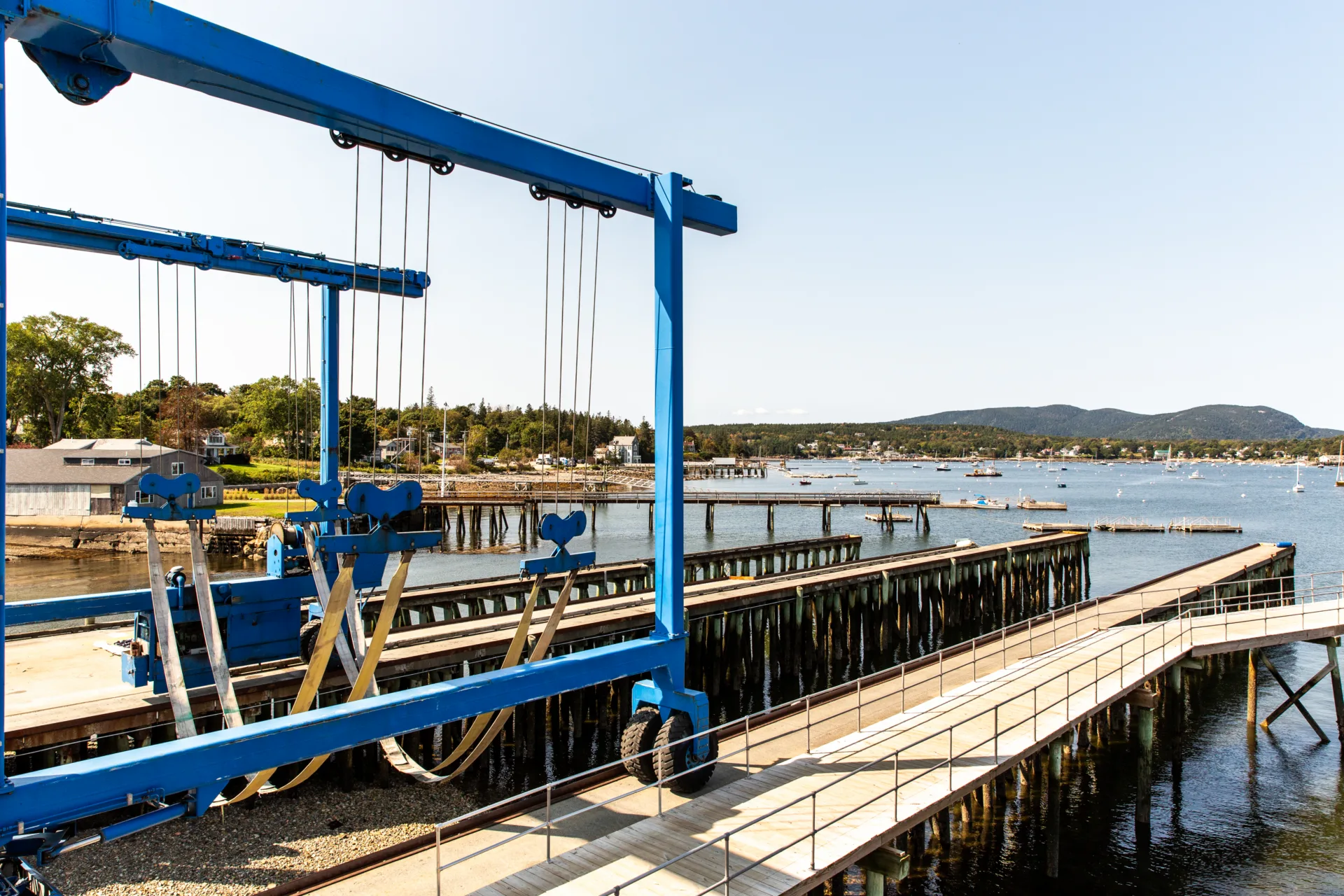 Blue marine lift positioned on the Northeast Harbor dock