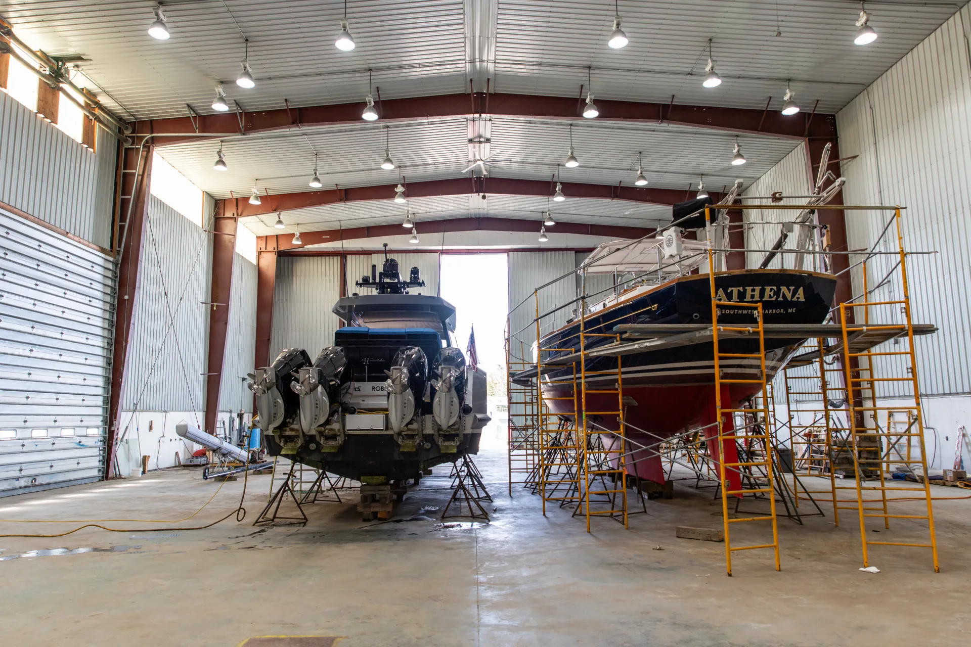 Sail and power yachts stored inside the Northeast Harbor service bay