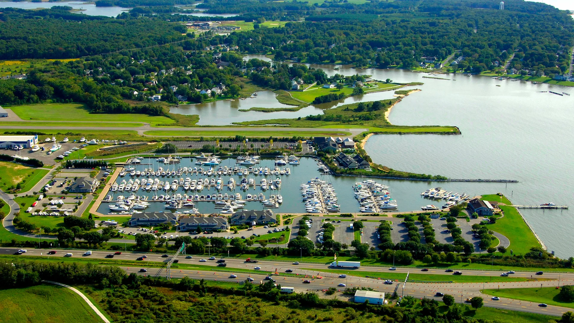 Aerial view of Bay Bridge Marina docks, boats, and shoreline in Stevensville