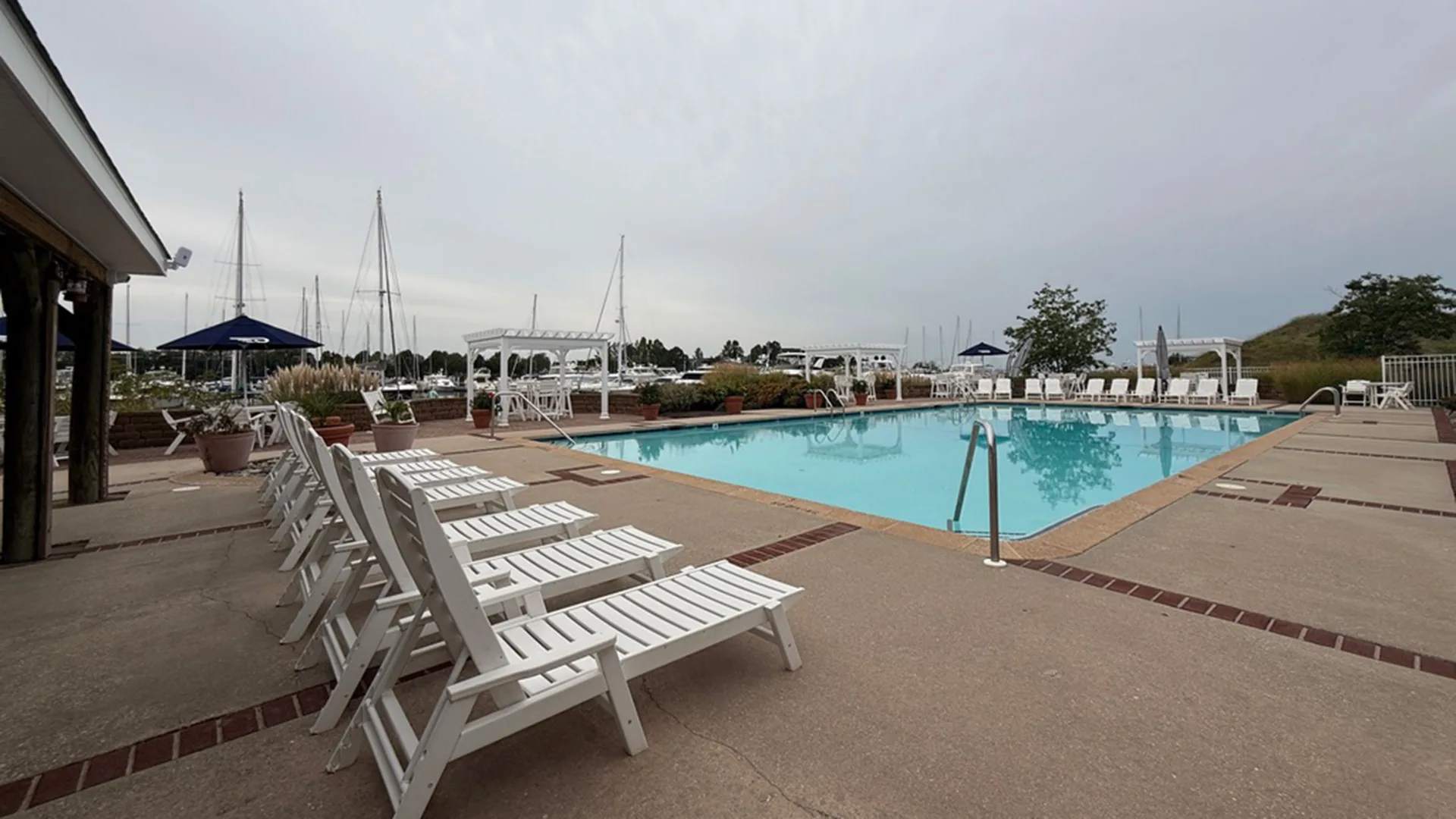 Pool area with lounge chairs at Bay Bridge Marina in Stevensville