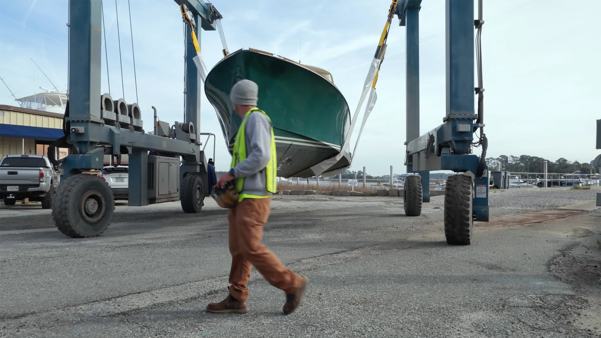 Travelift carrying a yacht through the Savannah service yard