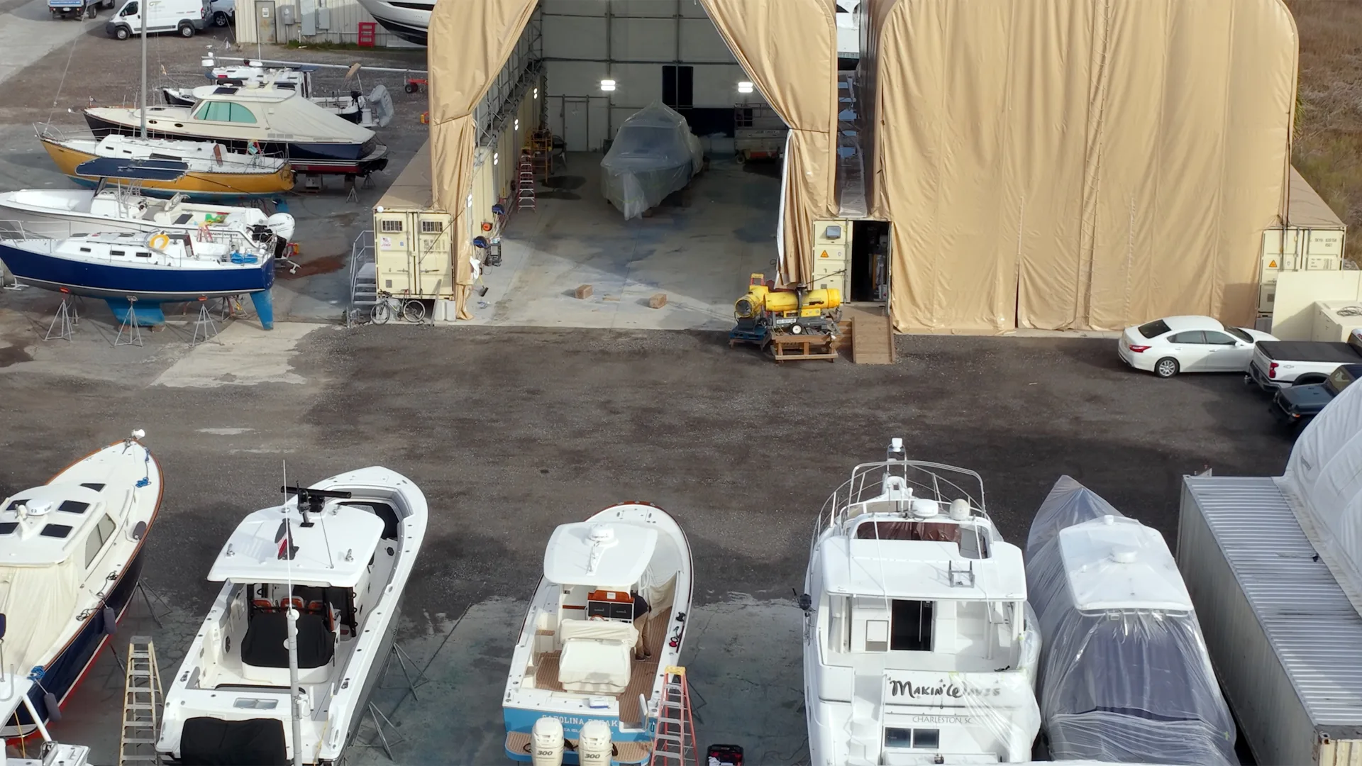 Boats on stands lined up outside the Savannah service sheds