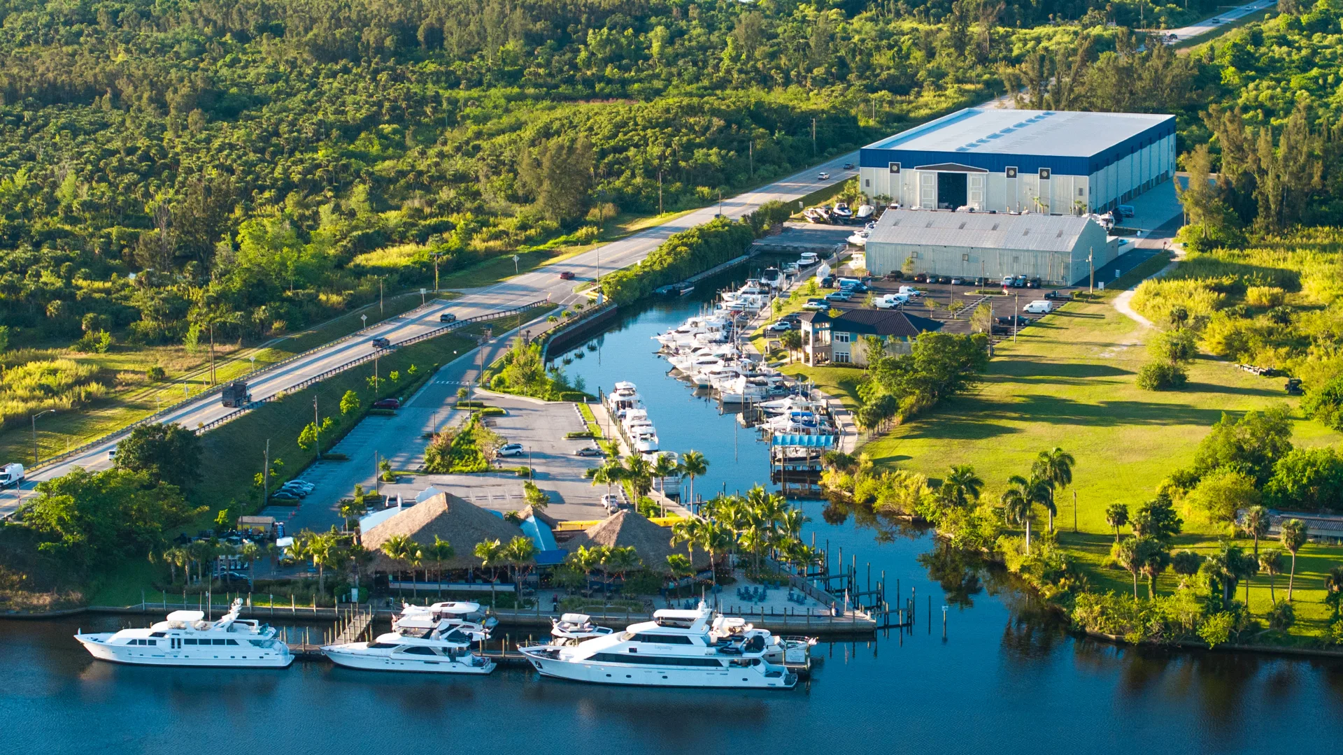 Aerial view of boats, service buildings, and the Fort Myers marina basin